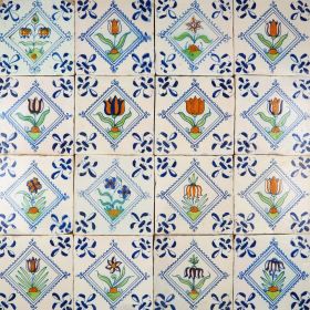 Rare 17th century set of Delft wall tiles with beautiful polychrome flowers in a diamond square