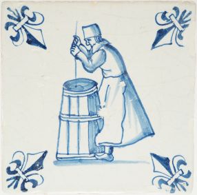 Antique Delft tile with a person churning butter, 17th century