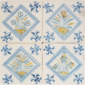 Set of four antique Delft tiles with flowers, 17th century