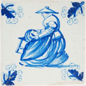 Antique Delft tile with a woman making baskets, 17th century