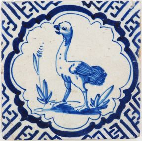 Antique Delft tile with an ostrich in a scalloped border inspired by Wanli motifs, 17th century