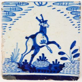 Rare antique Delft tile with a deer in blue in a so called Rotterdam open air landscape, early 17th century