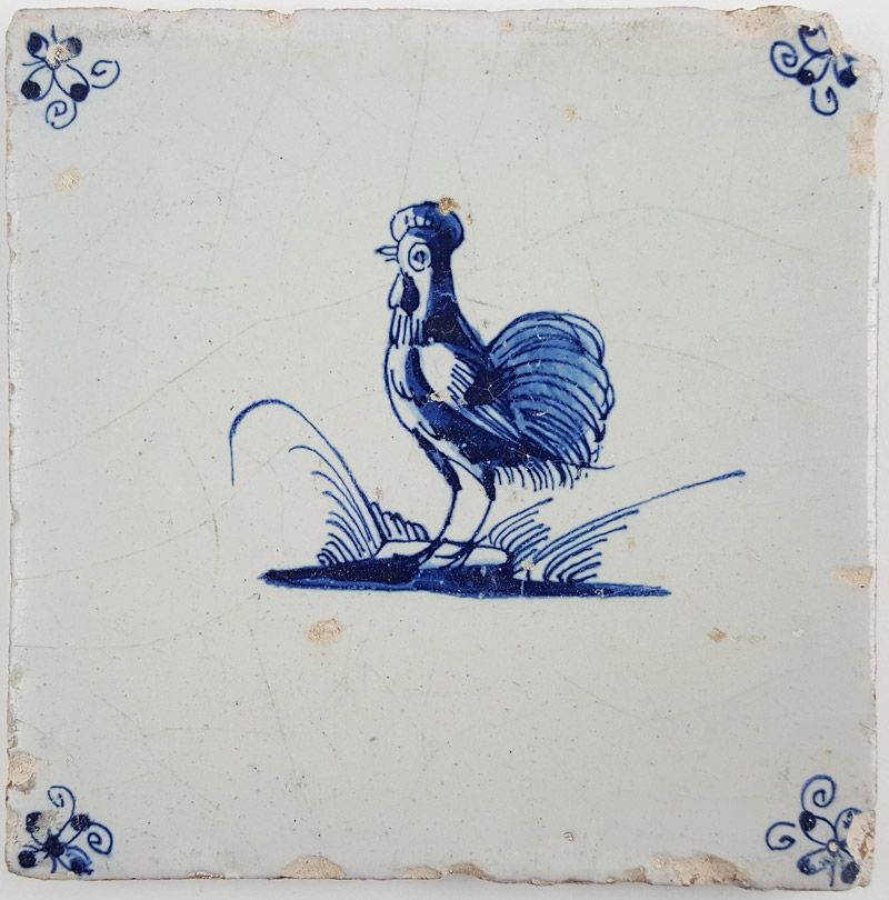 Antique Delft tile with a rooster in blue, 17th century